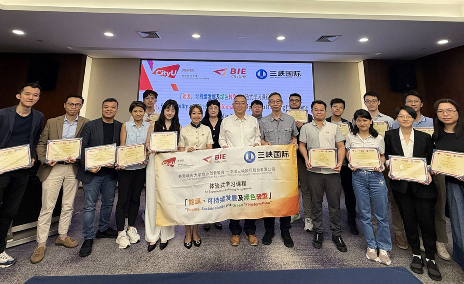Presentation of certificates of completion to students by Mr. Qin Guobin (秦国斌), Executive President of CTGI