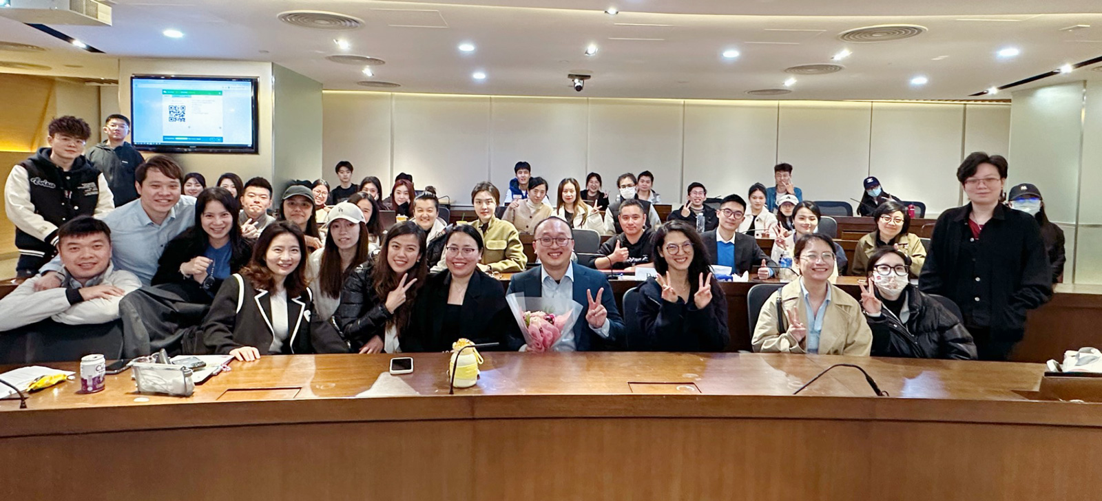 Professor Alvin Leung (centre with flower) and his students